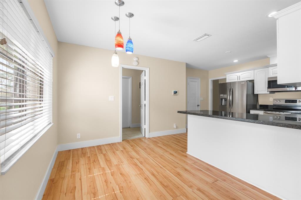 7836 Cloverfield Circle Boca Raton, FL 33433 - Photo 9 of 39 a very nice looking room with a large window