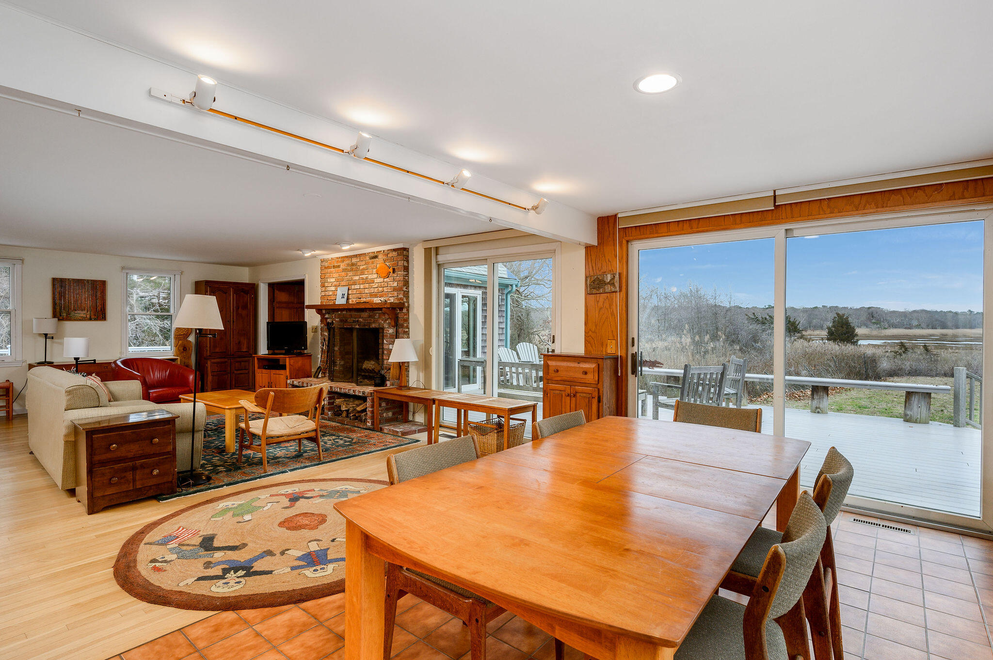 52 Captain Linnell Road Orleans, MA 02653 - Photo 13 of 45 a living room with furniture and a large window