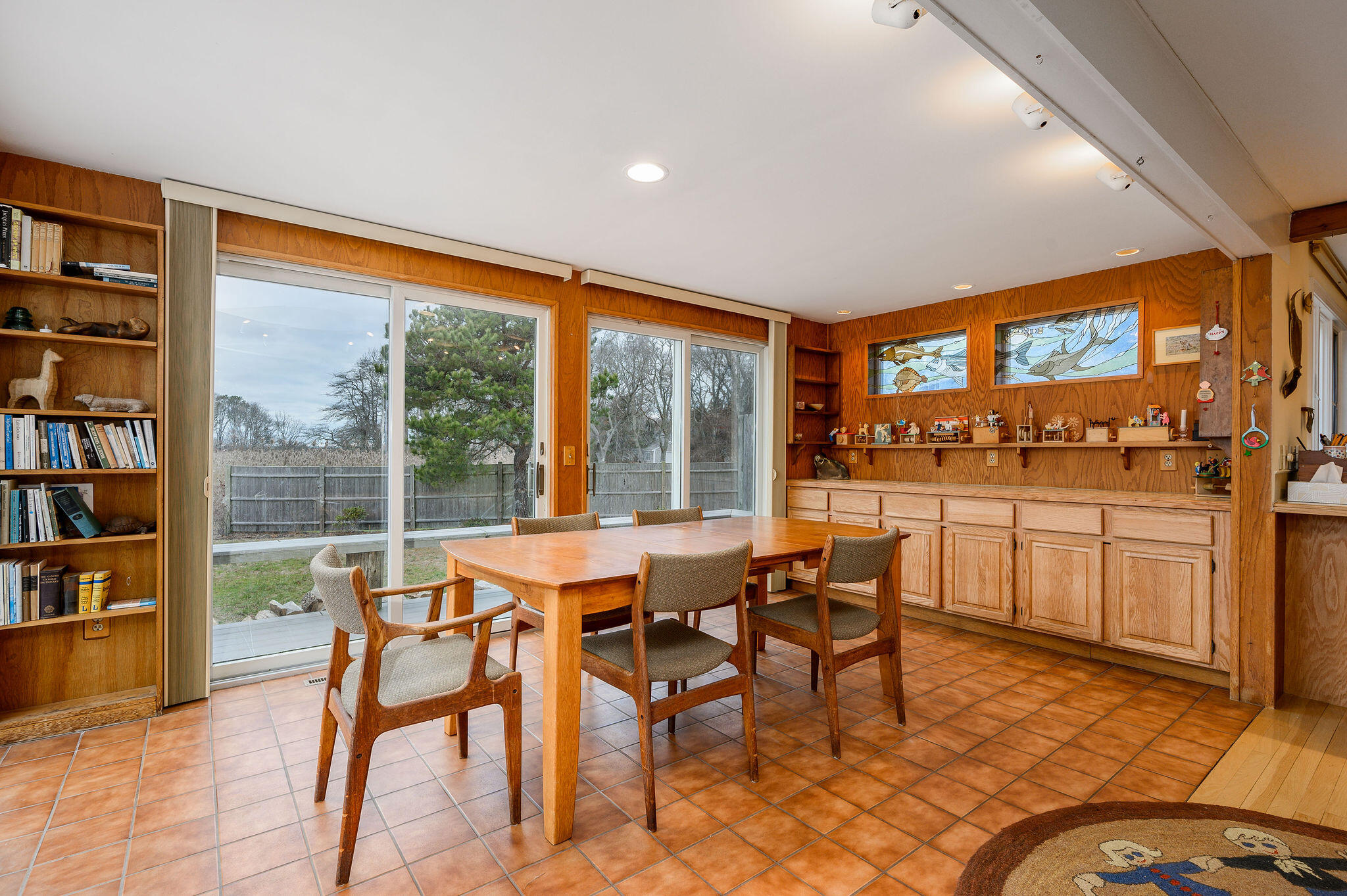 52 Captain Linnell Road Orleans, MA 02653 - Photo 14 of 45 a dining room with furniture and a floor to ceiling window