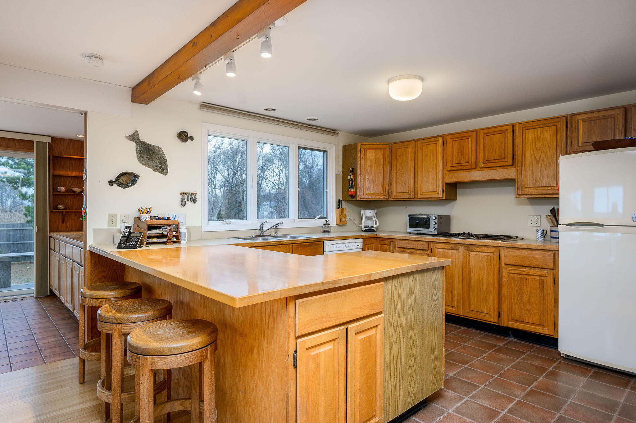 52 Captain Linnell Road Orleans, MA 02653 - Photo 19 of 45 a kitchen with stainless steel appliances granite countertop a sink and a refrigerator