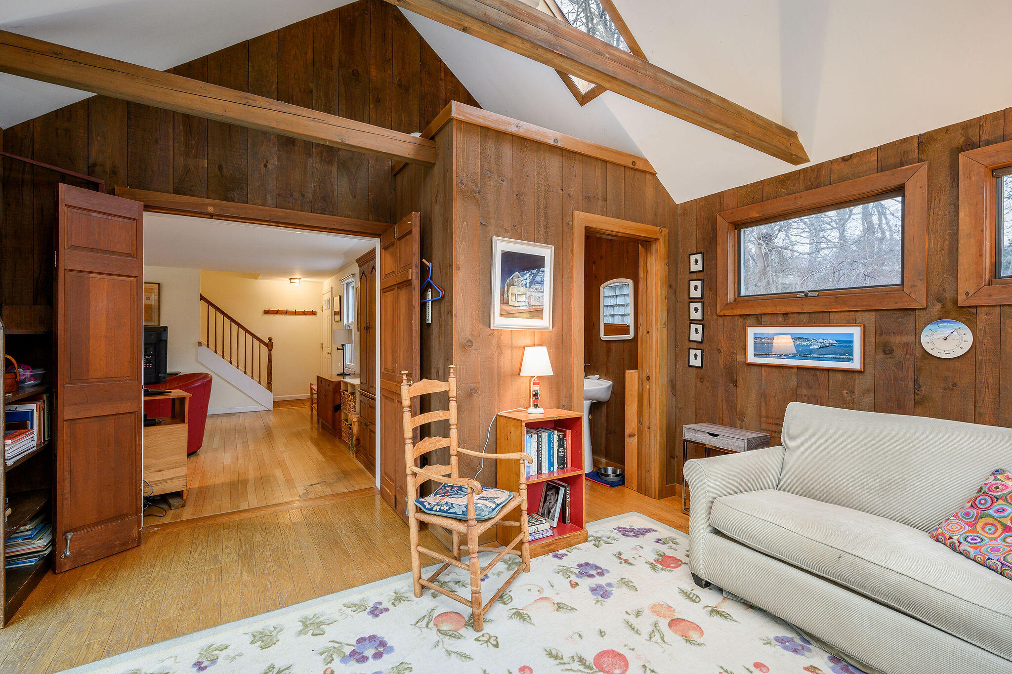 52 Captain Linnell Road Orleans, MA 02653 - Photo 22 of 45 a living room with furniture and a rug