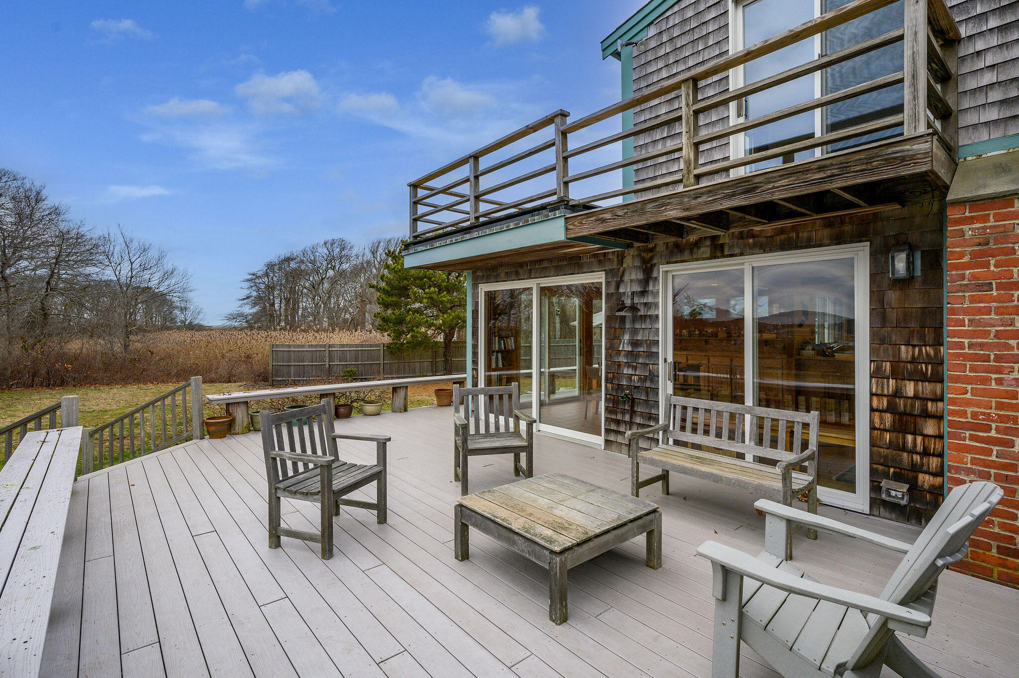 52 Captain Linnell Road Orleans, MA 02653 - Photo 25 of 45 a roof deck with a table and chairs