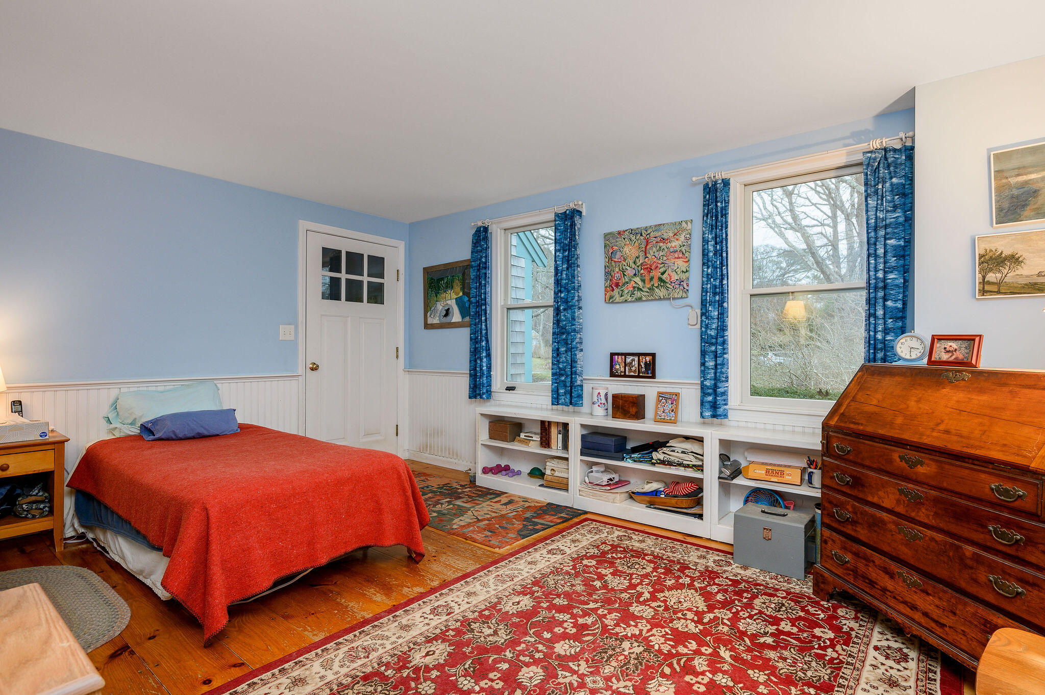 52 Captain Linnell Road Orleans, MA 02653 - Photo 26 of 45 a bedroom with a bed and a wooden floor