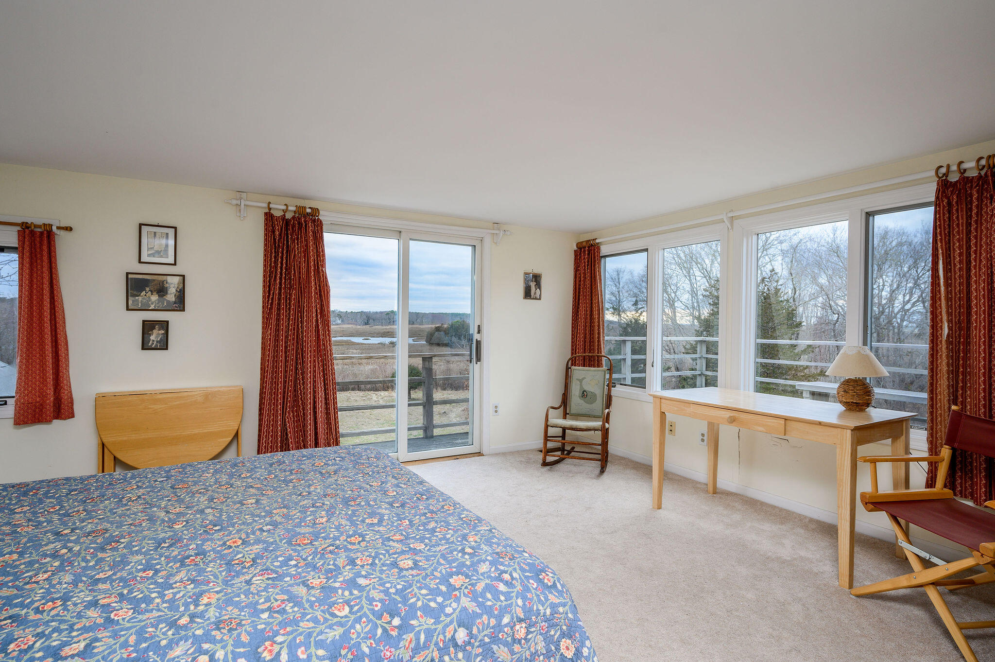 52 Captain Linnell Road Orleans, MA 02653 - Photo 29 of 45 a bedroom with a large bed and a large window