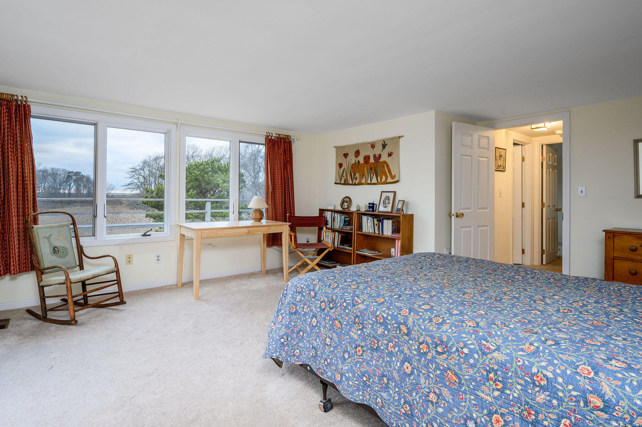 52 Captain Linnell Road Orleans, MA 02653 - Photo 30 of 45 a bedroom with a bed and large windows