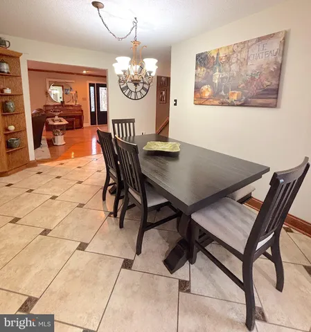 a view of a livingroom with furniture window and wooden floor