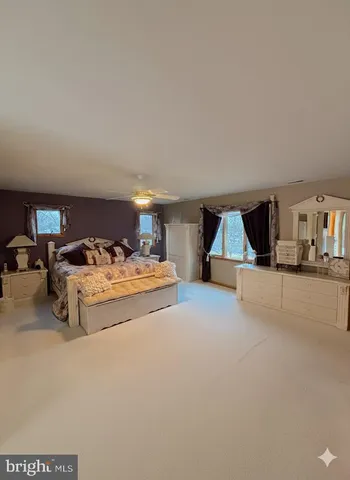 a view of staircase with white walls