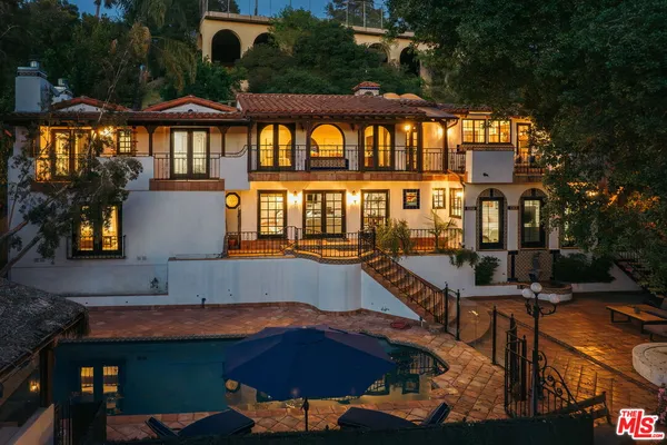 a view of a house with a swimming pool