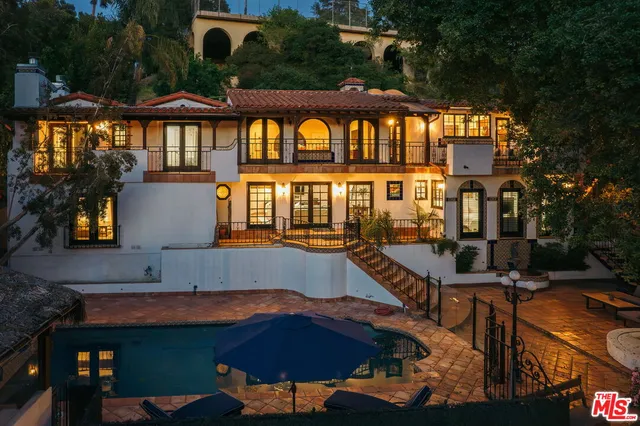 a view of a house with a swimming pool