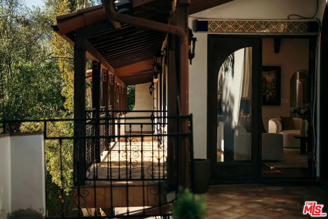 a kitchen with stainless steel appliances granite countertop a sink a stove and a wooden floors