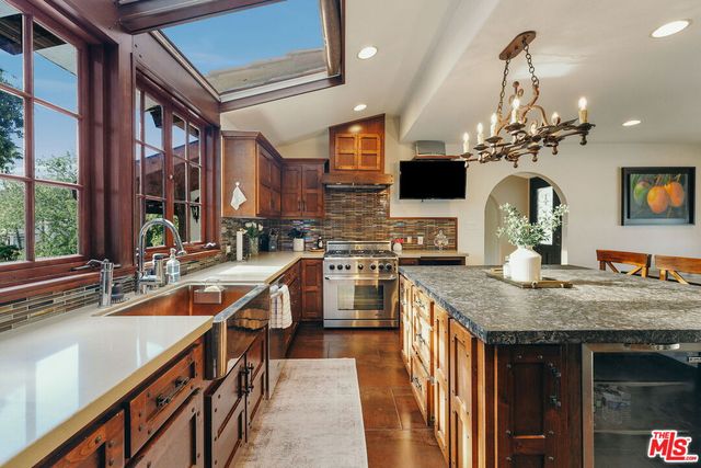a large bed sitting in a bedroom next to a window