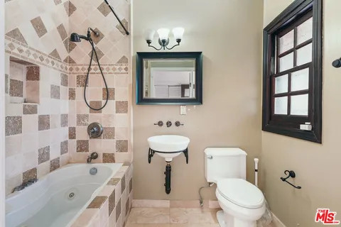 a bed room with a bed and a window