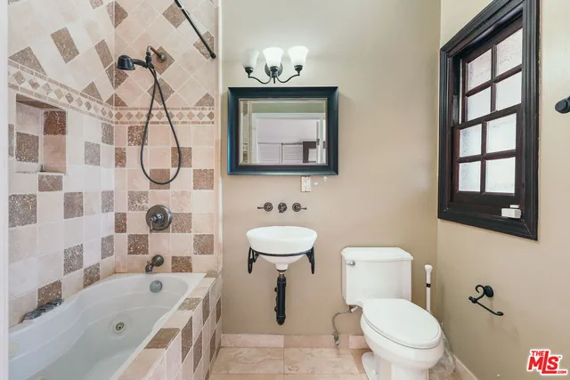 a bed room with a bed and a window