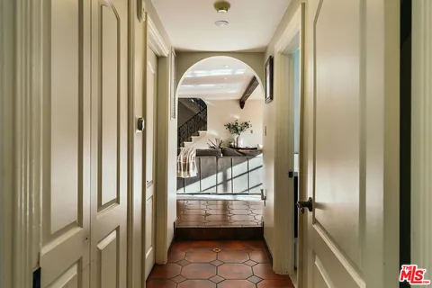 a bathroom with a toilet a sink and a mirror