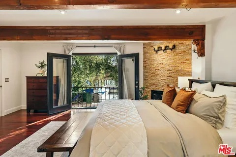 a swimming pool view with a seating space