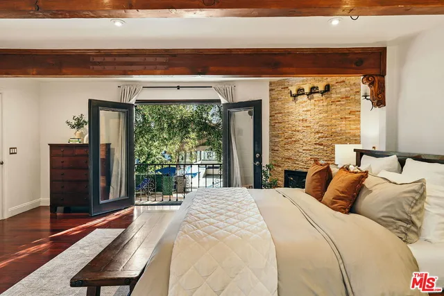 a swimming pool view with a seating space