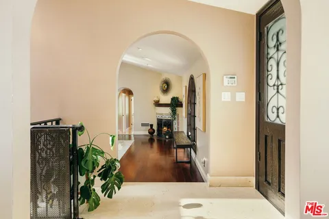 a living room with fireplace furniture and a flat screen tv