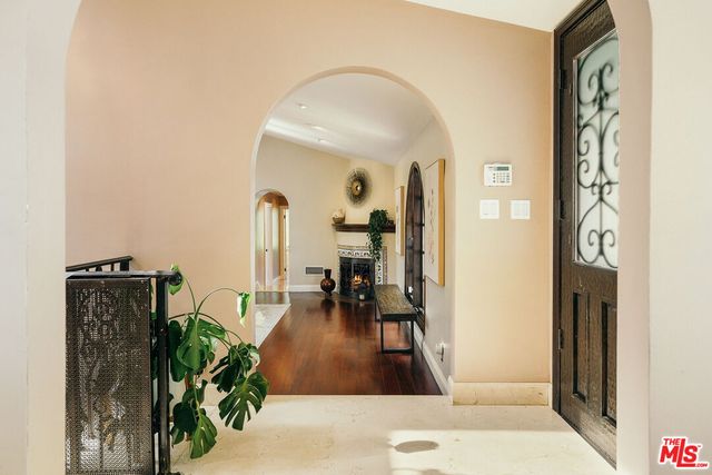 a living room with fireplace furniture and a flat screen tv