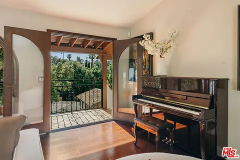 a large kitchen with a table and chairs