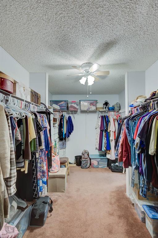 4896 Quiet Acres Road Shreveport, LA 71107 - Photo 16 of 39 a view of walk in closet with clothes