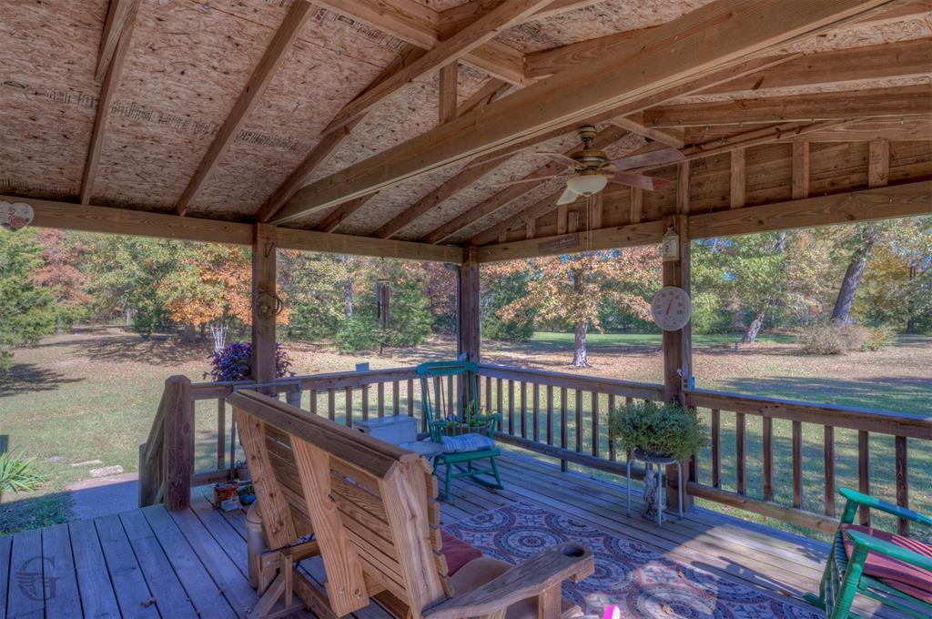 4896 Quiet Acres Road Shreveport, LA 71107 - Photo 2 of 39 a view of a chair and table in the balcony