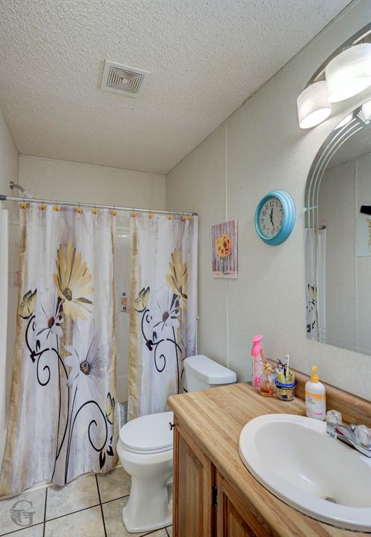 4896 Quiet Acres Road Shreveport, LA 71107 - Photo 22 of 39 a bathroom with a granite countertop sink and a mirror