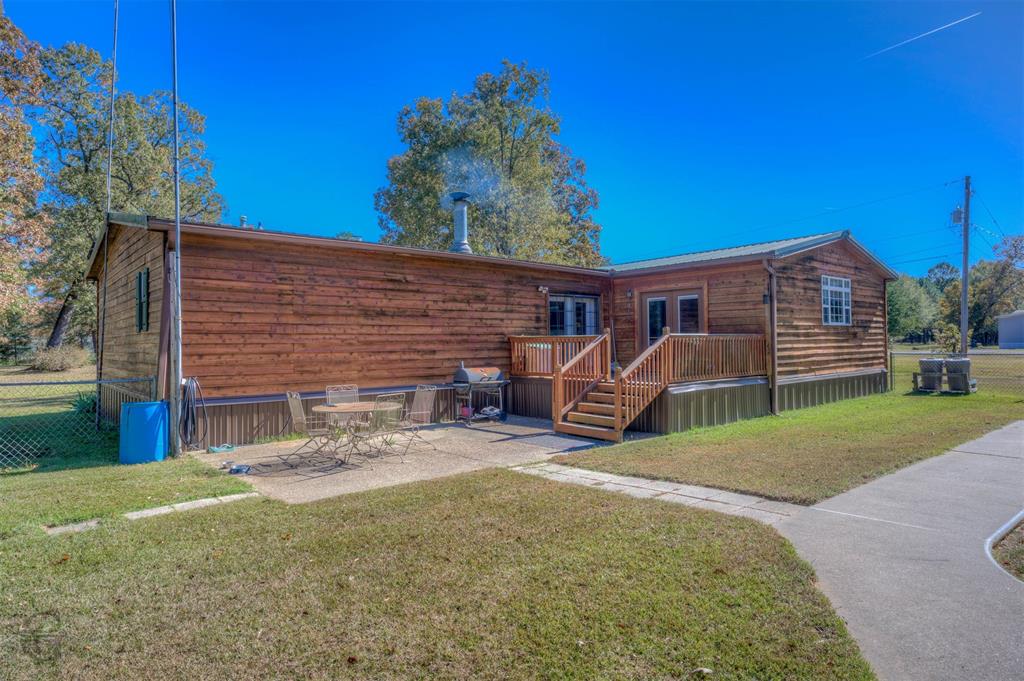 4896 Quiet Acres Road Shreveport, LA 71107 - Photo 25 of 39 a view of a house with backyard and porch
