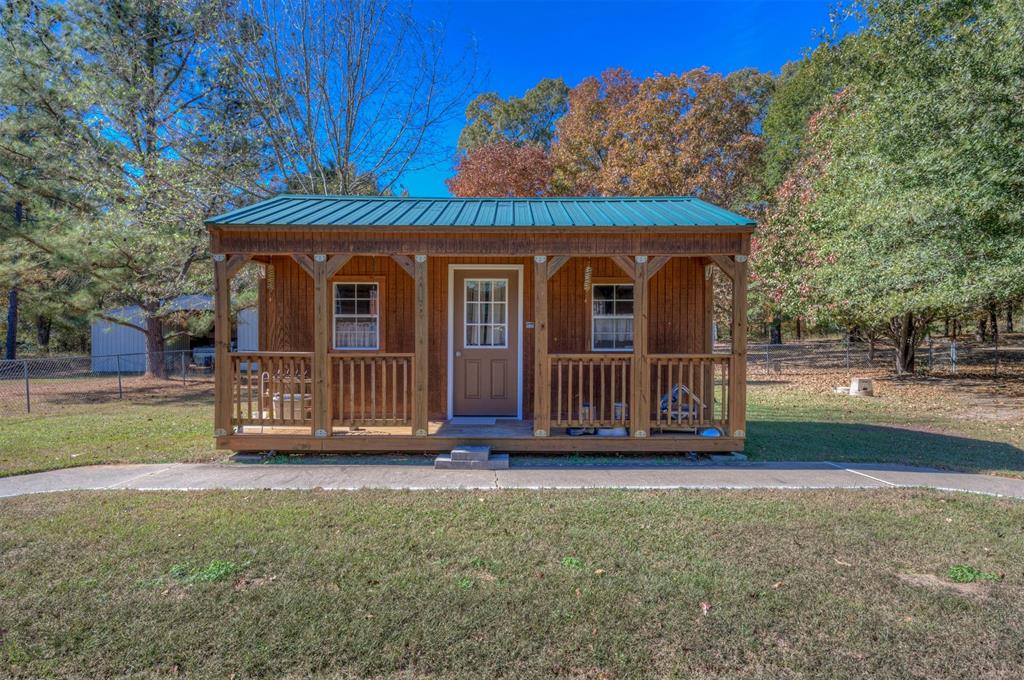 4896 Quiet Acres Road Shreveport, LA 71107 - Photo 28 of 39 a view of front door of a house with a yard