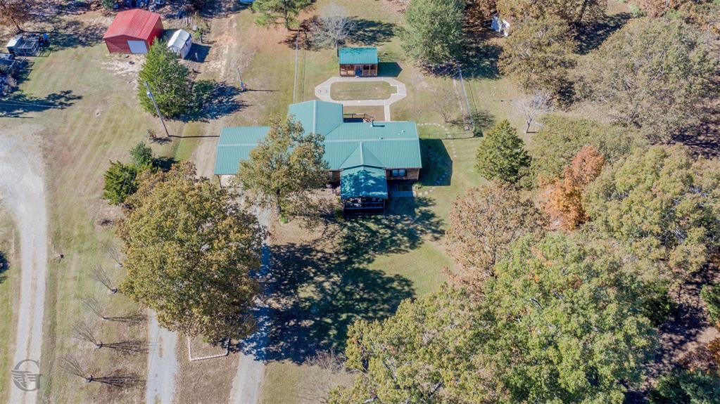 4896 Quiet Acres Road Shreveport, LA 71107 - Photo 32 of 39 an aerial view of a house with a yard and garden