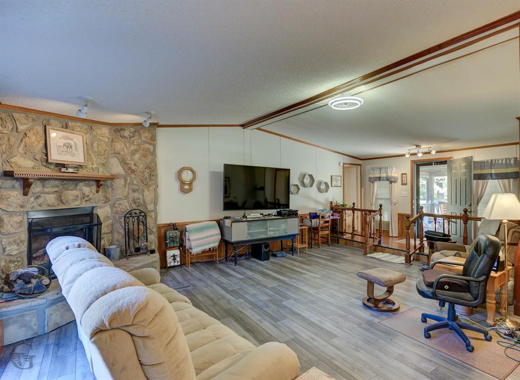 4896 Quiet Acres Road Shreveport, LA 71107 - Photo 6 of 39 a living room with furniture and a flat screen tv