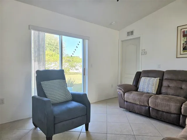 a kitchen with a stove a sink and a microwave