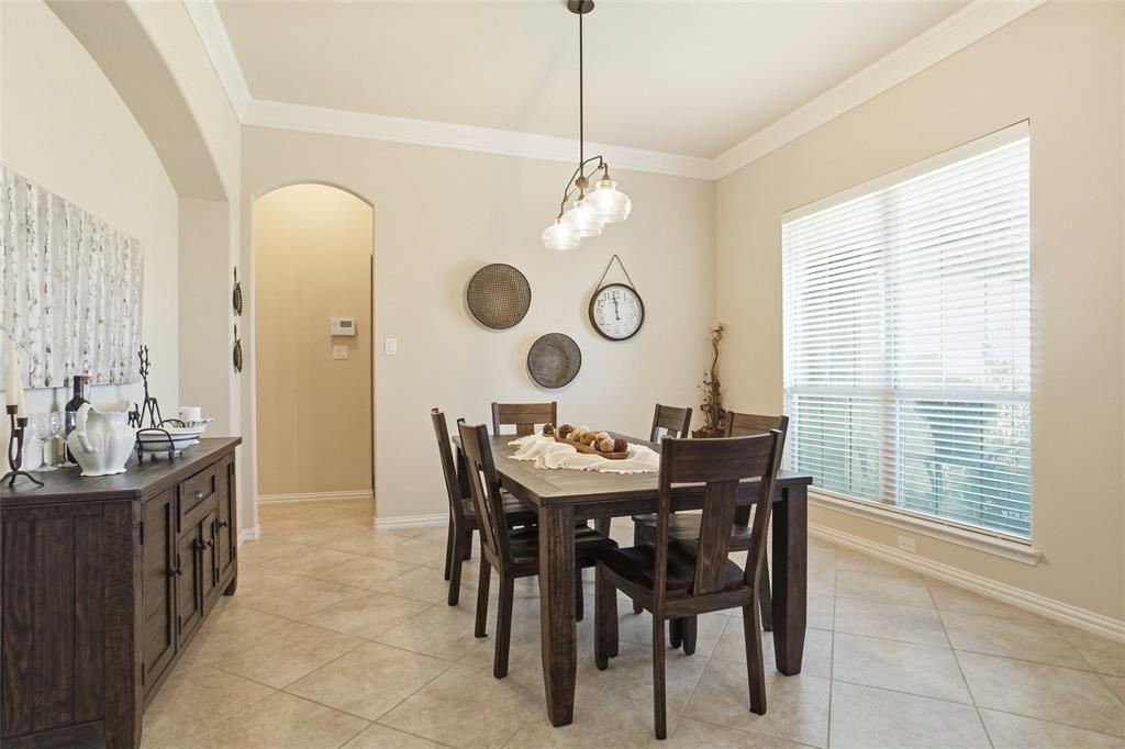 106 High Ridge Court Decatur, TX 76234 - Photo 2 of 19 a view of a dining room and a kitchen table and chairs