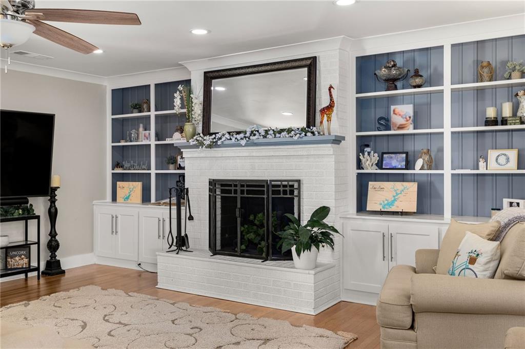 6470 Samoa Way Flowery Branch, GA 30542 - Photo 33 of 61 a living room with furniture and a fireplace