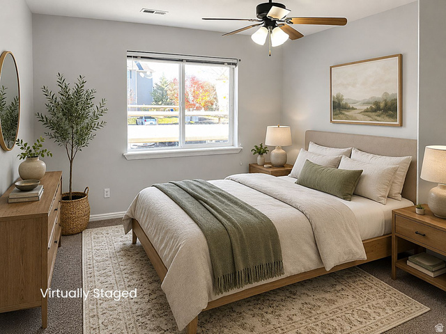8198 North Cedar Springs Road, Unit T6 Eagle Mountain, UT 84005 - Photo 6 of 13 Carpeted bedroom featuring a large window, a ceiling fan with integrated lighting, and light gray wall paint
