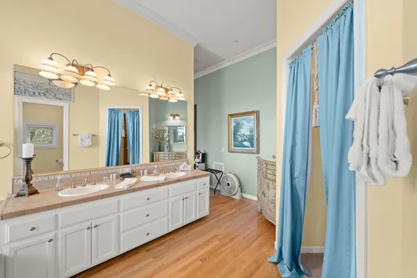 a bedroom with a bed next to a window with the outer view