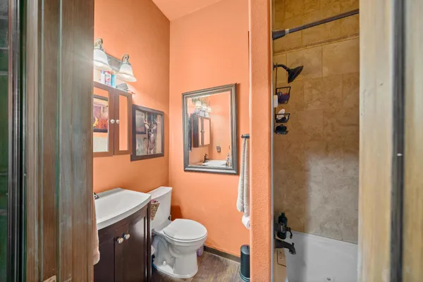 a view of a house with a yard and pathway