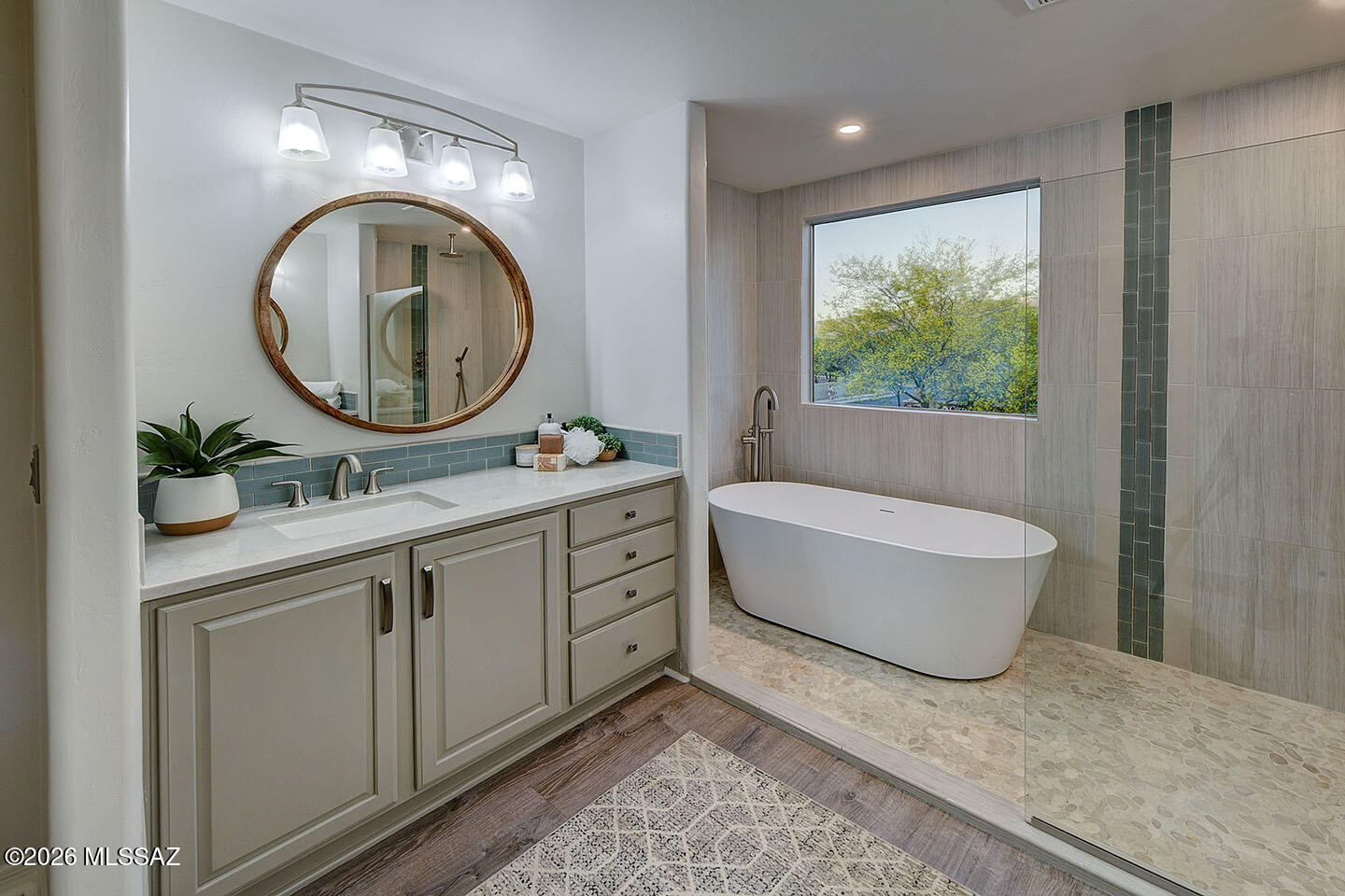 13464 North Piemonte Way Oro Valley, AZ 85755 - Photo 18 of 33 a bathroom with a granite countertop sink and a mirror