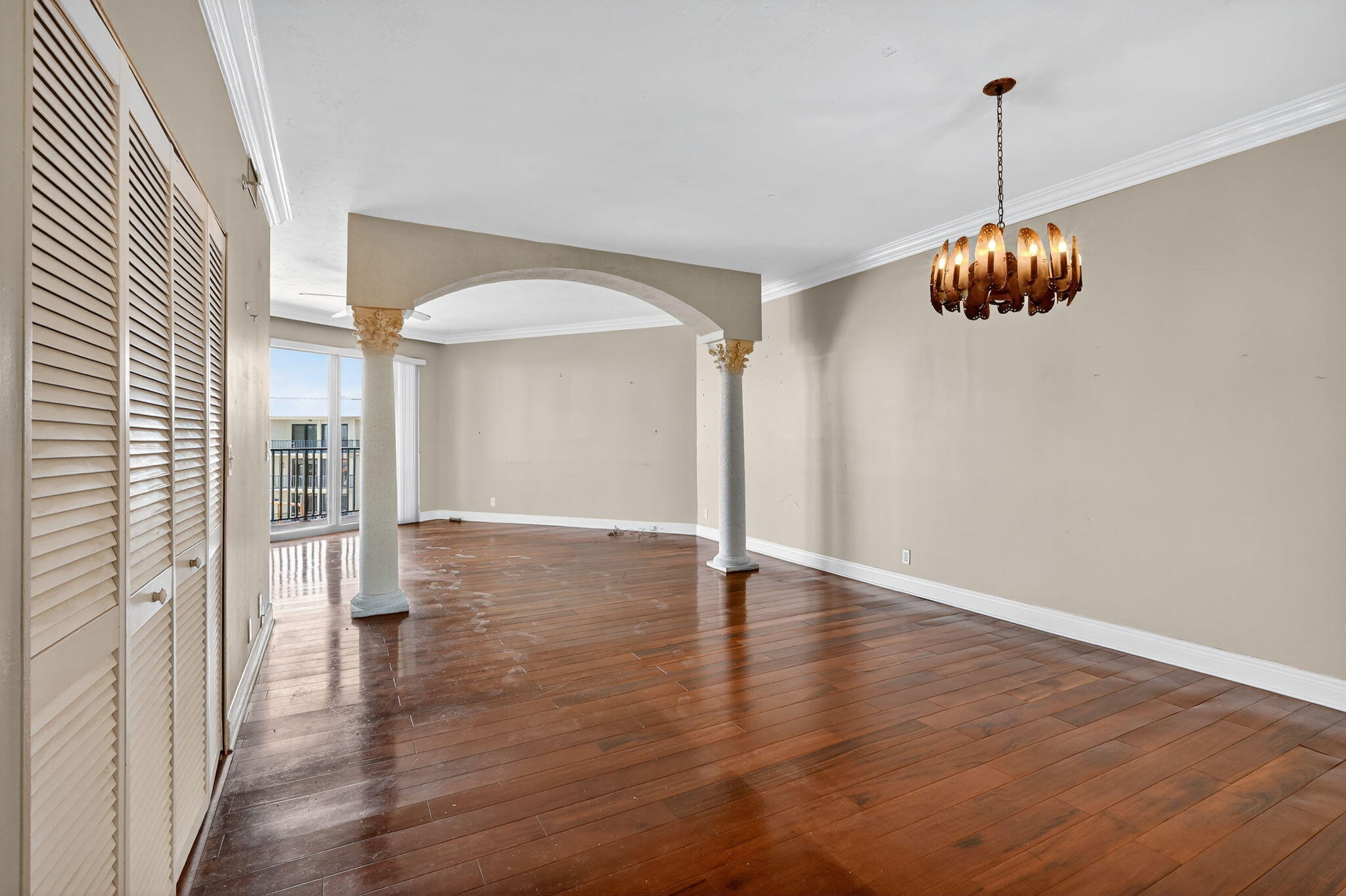 1035 South Federal Highway, Unit PH3 39 Delray Beach, FL 33483 - Photo 11 of 44 an empty room with wooden floor and windows