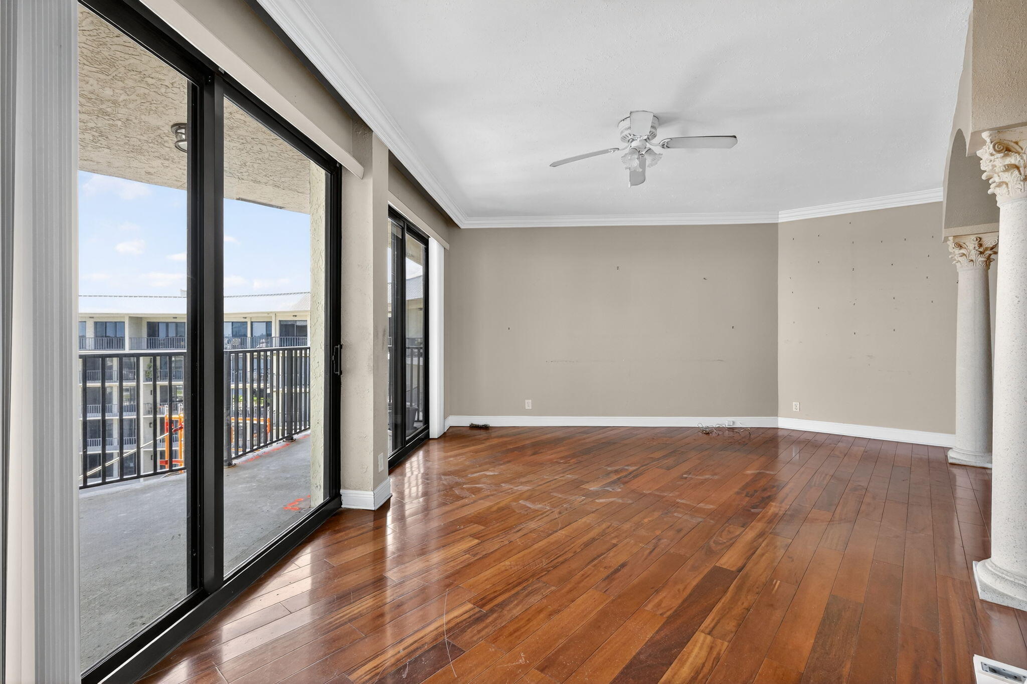 1035 South Federal Highway, Unit PH3 39 Delray Beach, FL 33483 - Photo 12 of 44 a view of an empty room with wooden floor and a window