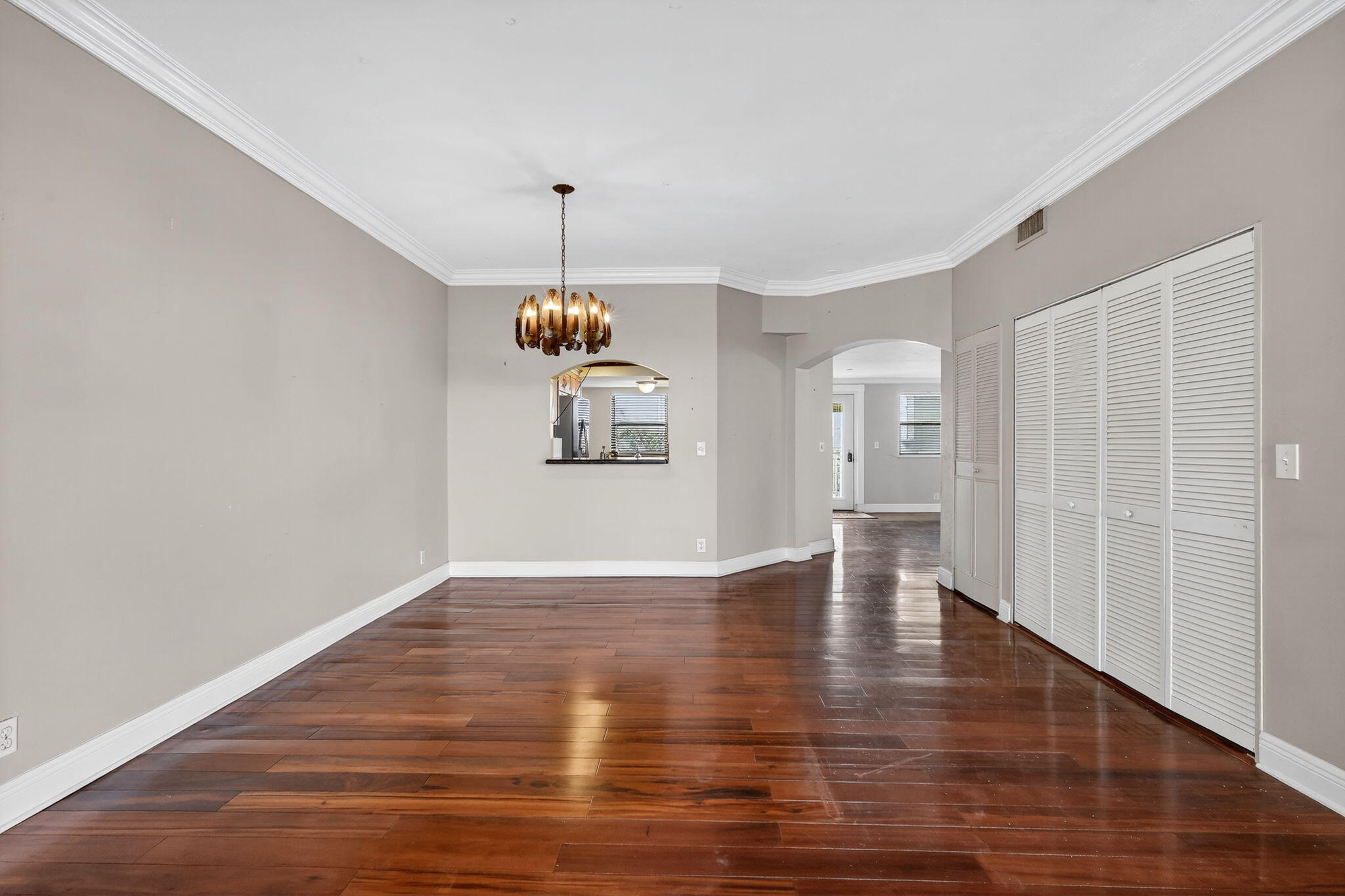 1035 South Federal Highway, Unit PH3 39 Delray Beach, FL 33483 - Photo 13 of 44 a view of empty room with wooden floor and window