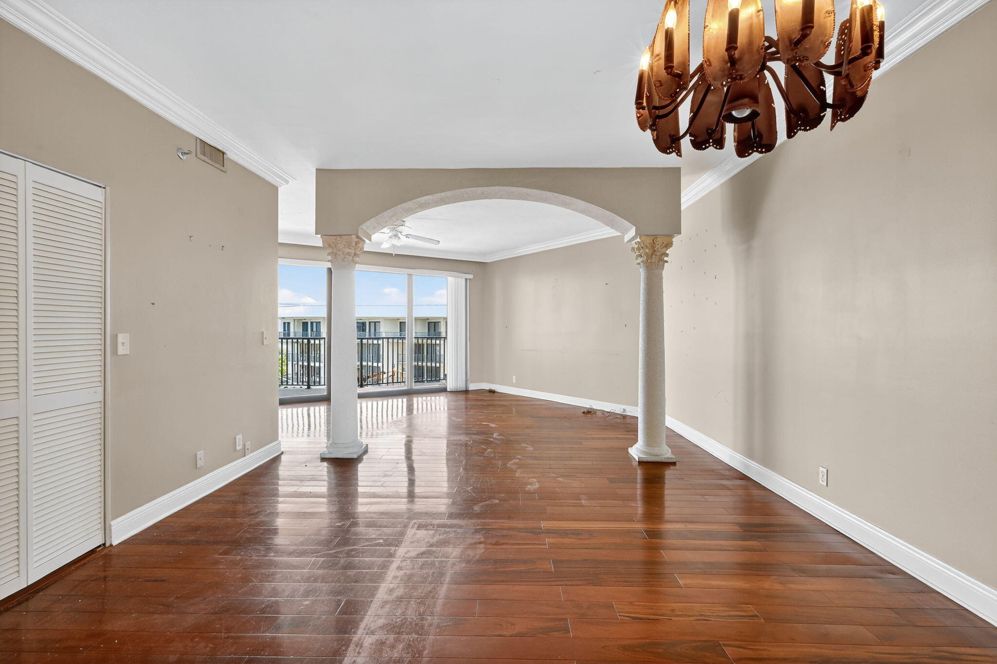 1035 South Federal Highway, Unit PH3 39 Delray Beach, FL 33483 - Photo 14 of 44 a view of an empty room with wooden floor and a window