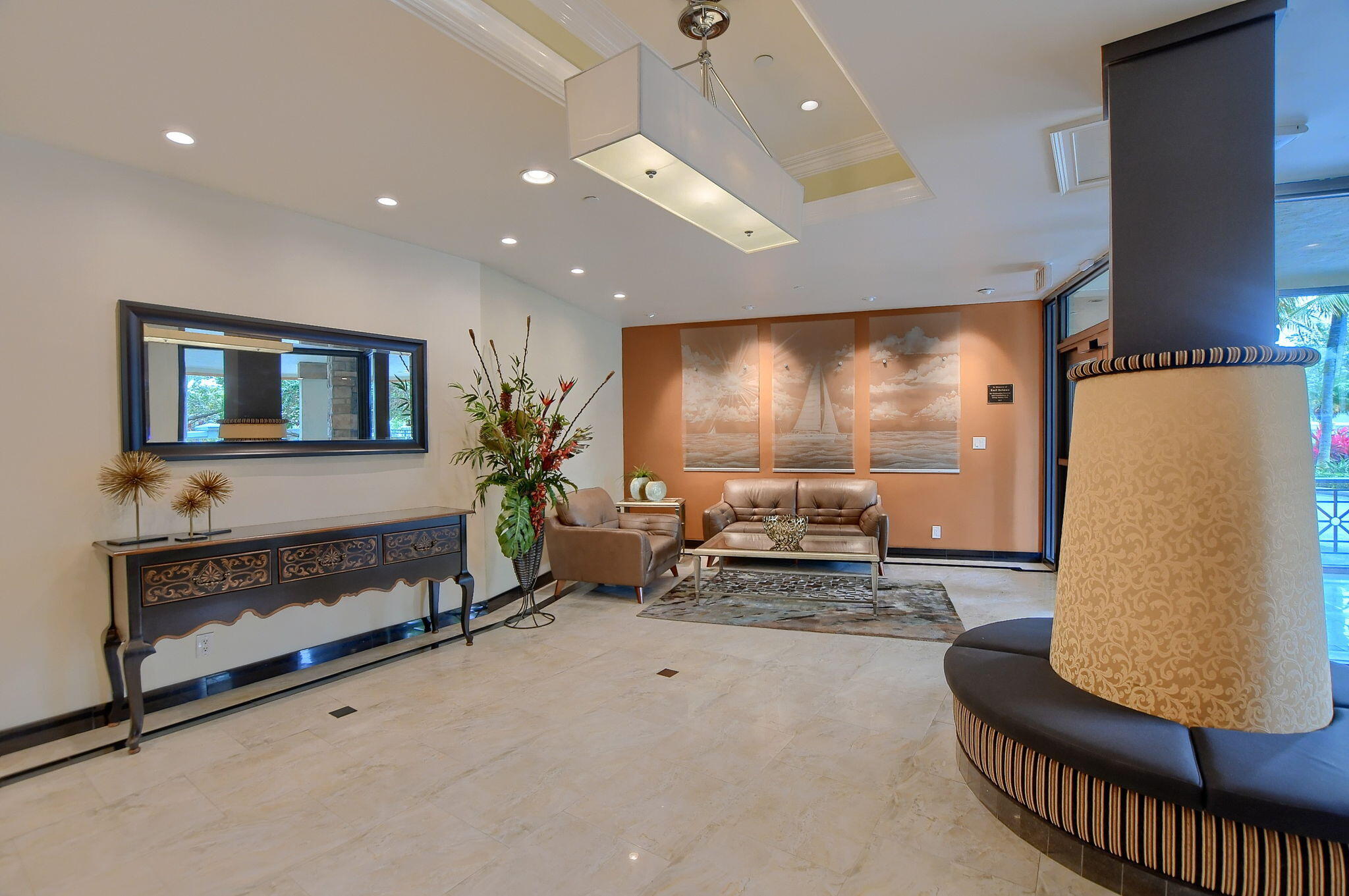 1035 South Federal Highway, Unit PH3 39 Delray Beach, FL 33483 - Photo 33 of 44 a living room with furniture and a flat screen tv