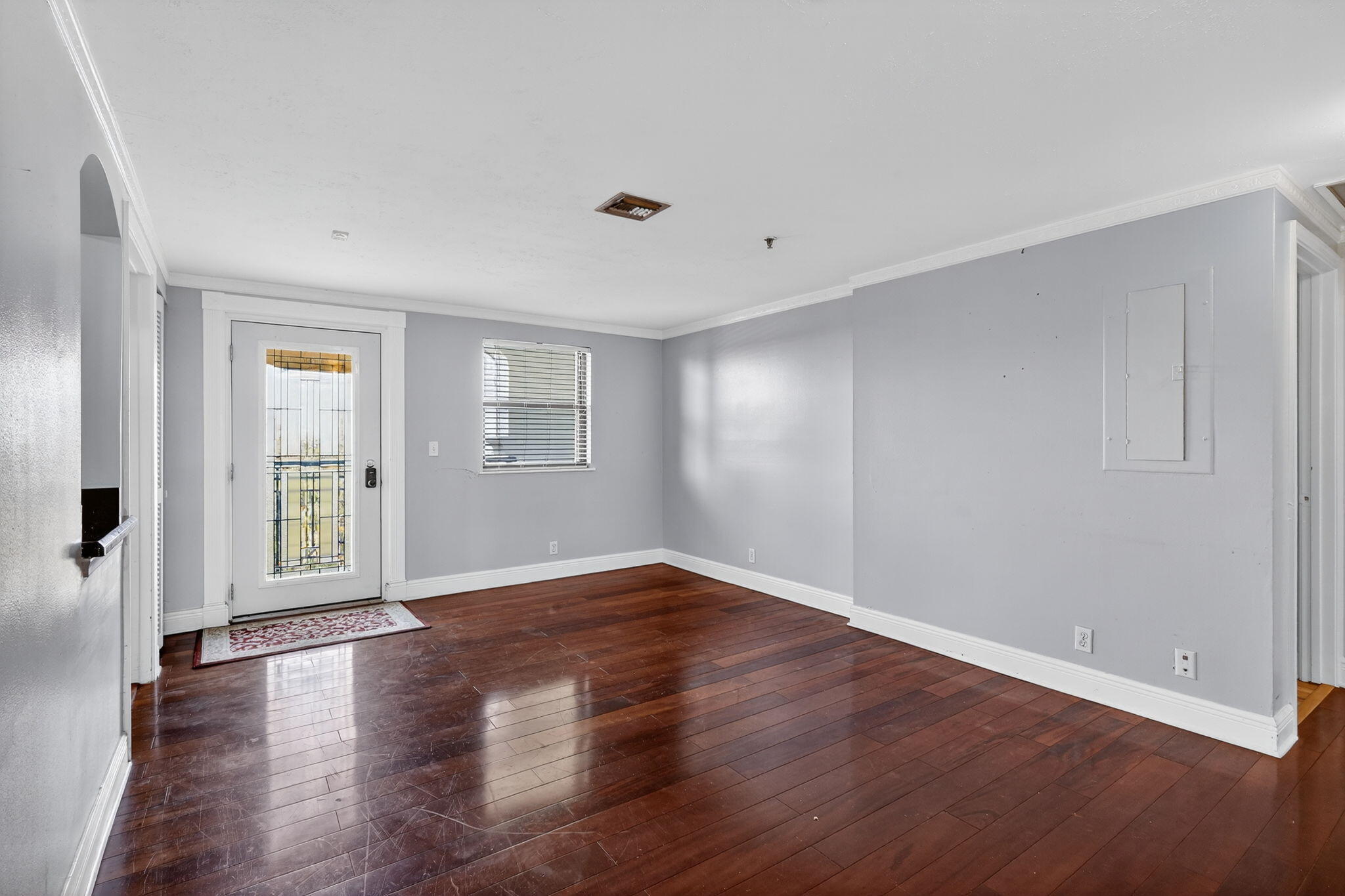 1035 South Federal Highway, Unit PH3 39 Delray Beach, FL 33483 - Photo 8 of 44 an empty room with wooden floor and windows