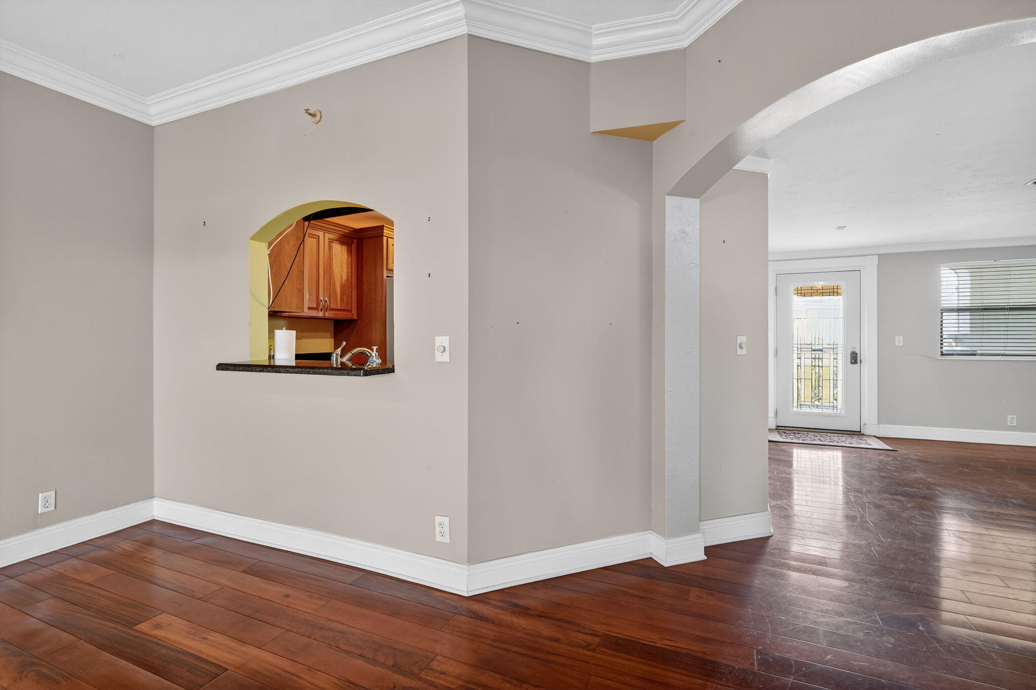 1035 South Federal Highway, Unit PH3 39 Delray Beach, FL 33483 - Photo 10 of 44 a view of a room with wooden floor and a window