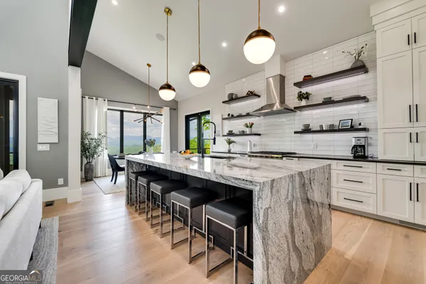a kitchen with stove and cabinets