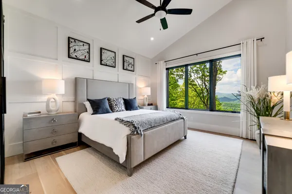 a bathroom with a tub a sink and a shower