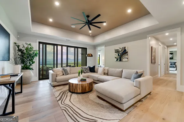 a living room with furniture and a patio