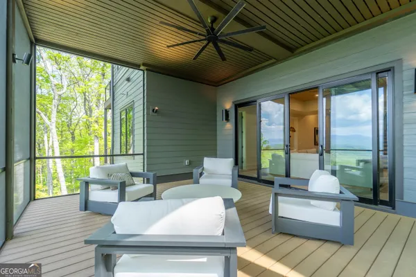 a bathroom with a sink a toilet a shower and a mirror