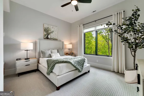 a bedroom with a bed and a couch