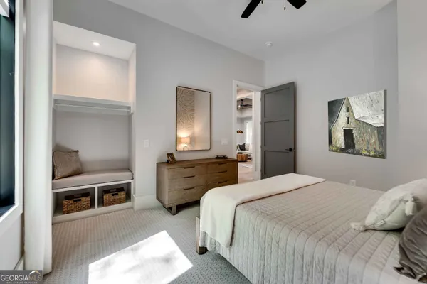 a bathroom with a toilet and a shower curtain